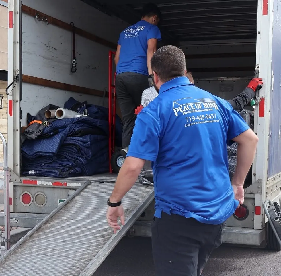 Peace of Mind movers loading a moving truck